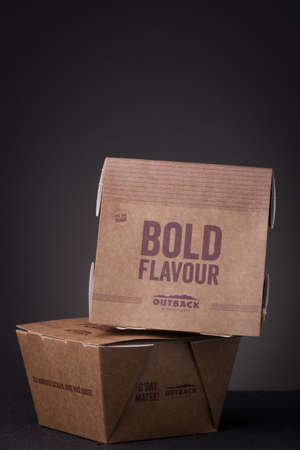 RIO DE JANEIRO, BRAZIL - Jul 01, 2020: Two meal delivery cardboard boxes of Outback steakhouse...