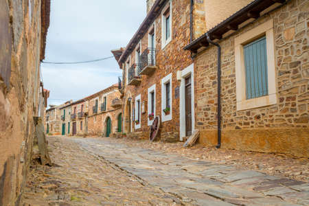 CASTRILLO DE LOS POLVAZARES, SPAIN - May 18, 2018: Castrillo de los Polvazares, Leon, Spain, May 2018: view on the streets and traditional stone houses of this historical villageのeditorial素材