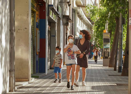 BARCELONA, SPAIN - Apr 04, 2020: People on street during COVID-19  pandemic in Barcelona,Spain. Coronavirus Social Distancing.のeditorial素材