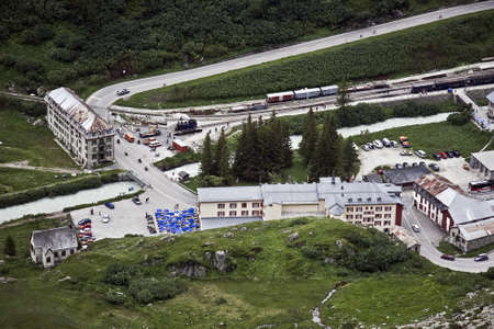 An aerial shot of the road surrounded by greenery and housesのeditorial素材