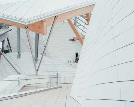 A white business center with beautiful textures and a unique design with interior staircasesのeditorial素材
