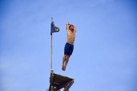 NEGRIL, JAMAICA - Aug 05, 2016: Ricks CafÃ©, Negril, Jamaica â August 2016: David Colturi Red bull cliff diver jumping off platformのeditorial素材