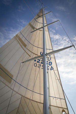 BAYFIELD, UNITED STATES - Jul 30, 2011: A vertical image of a racing sailboat mast under sail on Lake Superior.のeditorial素材
