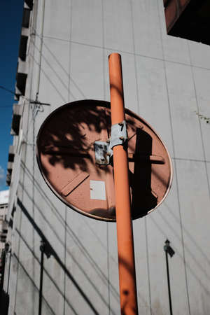 MATSUYAMA, JAPAN - Sep 23, 2019: A vertical closeup shot of a round red road sign pole from behindのeditorial素材
