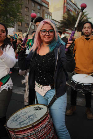SANTIAGO, CHILE - Sep 27, 2019: In Santiago Chile Global strike for planet, students protesting during fridays for future. Hands and posters up to the sky,のeditorial素材