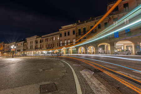 PADUA, ITALY - Apr 01, 2018: light trails left by the tram that crosses the city of Padua for the public city service at nightのeditorial素材