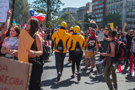 SANTIAGO, CHILE - Nov 28, 2019: The protests show their dissatisfaction with the Chilean government due to the social crisis that plagues President PiÃ±era and Chileのeditorial素材