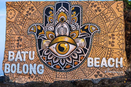 BALI, INDONESIA - Oct 01, 2019: graffiti of khamsa, khmissa or tafust, fatima hand on a wall in batu balong beach Canggu Bali indonesia street artのeditorial素材