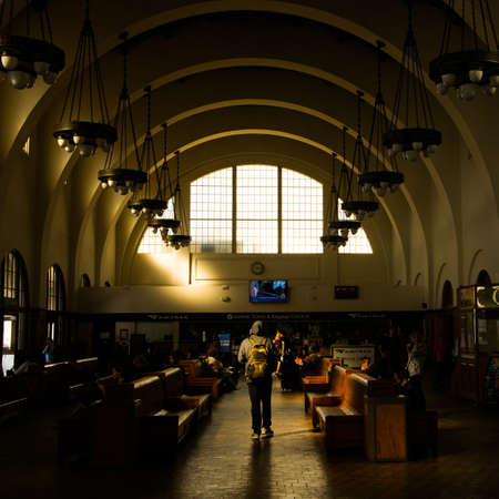 The cascading light casts into the train stationのeditorial素材