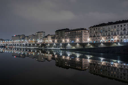 TURIN, ITALY - Jan 20, 2018: the river that passes through center of town and with the lights and buildings reflected in old Murazzi districtのeditorial素材