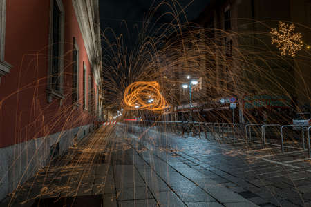 MILAN, ITALY - Jan 20, 2018: light painting and steel wool between the streets and streets of the...
