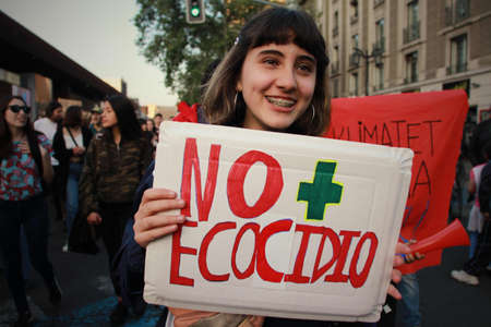 SANTIAGO, CHILE - Sep 27, 2019: In Santiago Chile Global strike for planet, students protesting during fridays for future. Hands and posters up to the sky,のeditorial素材