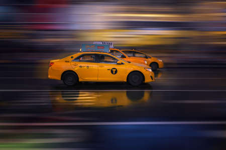 NYC, UNITED STATES - Dec 18, 2018: Cabs racing each other for a fare.のeditorial素材