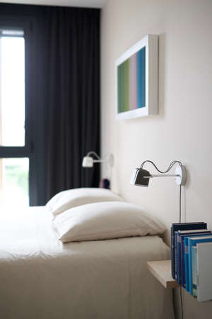 BORDEAUX, FRANCE - Sep 25, 2019: Cosy bedroom with books and wall lightsのeditorial素材