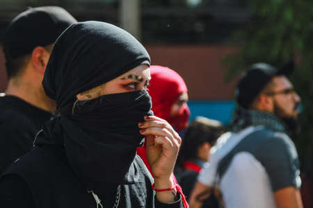 SANTIAGO, CHILE - Nov 28, 2019: The protests show their dissatisfaction with the Chilean government due to the social crisis that plagues President PiÃ±era and Chileのeditorial素材