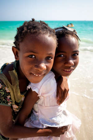 AMBATOMILO, MADAGASCAR - Aug 15, 2019: Two sibilings on the beachのeditorial素材