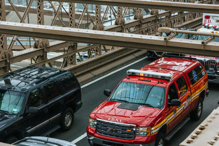 NEW YORK, UNITED STATES - Sep 21, 2017: An emergency vehicle responds to an emergency on the Brooklyn Bridge.のeditorial素材