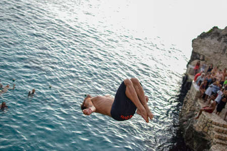 NEGRIL, JAMAICA - Aug 05, 2016: Ricks CafÃ©, Negril, Jamaica â August 2016: David Colturi Red bull cliff diver jumping off platformのeditorial素材