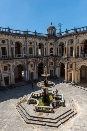 The Convent of Christ with fountains under a blue sky and sunlight in Tomar in Portugalのeditorial素材