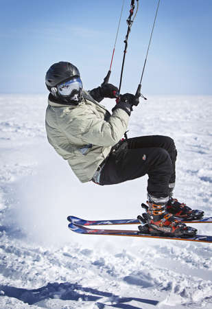 GARRISON, UNITED STATES - Apr 01, 2014: Colorful snow kites cover the sky as skiers race across Lake Mille Lacs in Garrison, Minnesota.のeditorial素材
