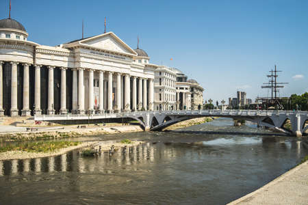 The Archaeological Museum of Macedonia surrounded by the river with a bridge on it in north Macedoniaのeditorial素材