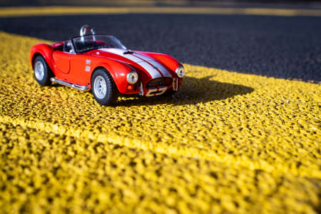 MEMPHIS, UNITED STATES - Nov 10, 2019: 1/32 scale sports car on asphalt
