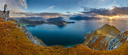 A panoramic shot of the hill Veggen near the sea under a blue sky in Norwayのeditorial素材