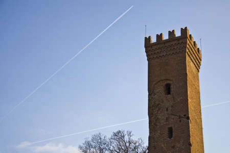 A beautiful shot of an old observation tower with airplane trails in the backgroundのeditorial素材