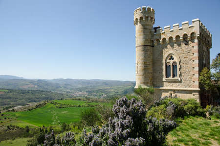 The Magdala tower in front of a green meadow in Rennes-le-Chateau, Franceのeditorial素材