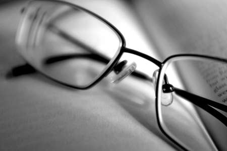 A closeup selective focus shot of glasses on a book
