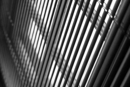A low angle shot of metal blinds in front of a windowの写真素材