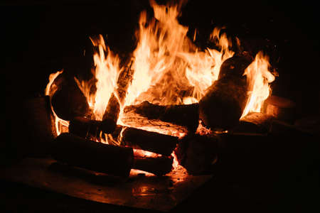 A campfire slowly burning through the night.の写真素材