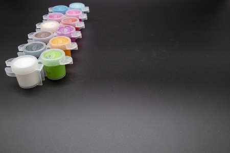 GLOUCESTER, UNITED KINGDOM - Jan 06, 2020: Paint pots containing acrylic paint ideal for hobby craft