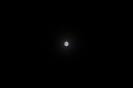 A beautiful shot of the moon in the night sky - great for a cool backgroundの写真素材