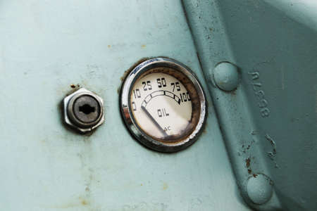 A vintage car oil gauge indicator.  Car maintenance concept image.の写真素材