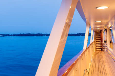 A beautiful shot from the yacht of the sea under a blue cloudy skyの写真素材