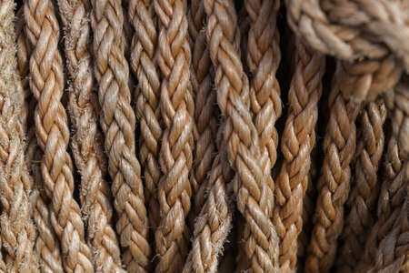 A closeup of red ropes under sunlight - a nice picture for backgrounds and wallpapersの写真素材