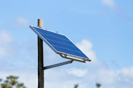 A low angle selective focus shot of a solar panel under the clear blue sky