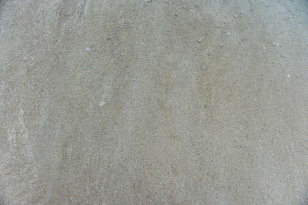 A high angle shot of the sandy beach on a summer day