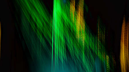 A green and yellow abstract lights on a black background