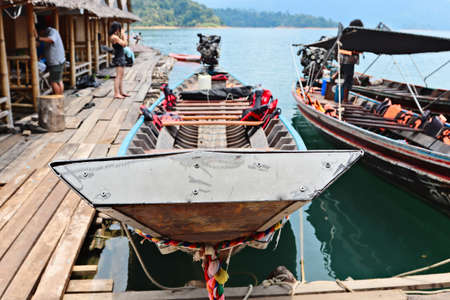 A scenery of boats tied with colorful ropes at the port