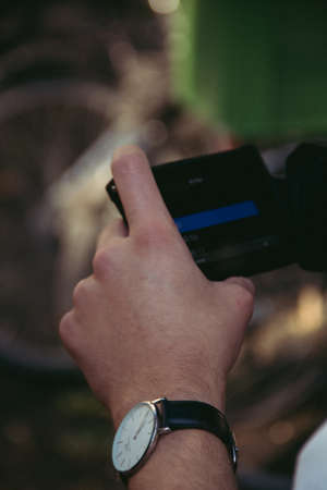 A vertical shot of a person checking the camera during a film production