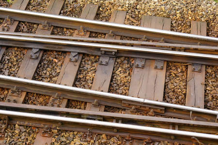 A high angle closeup shot of the wooden rails of a train