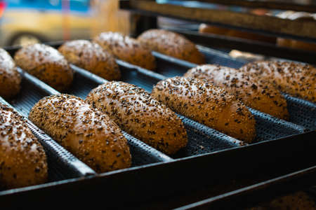 A closeup shot of freshly baked bread in a bakeryの写真素材