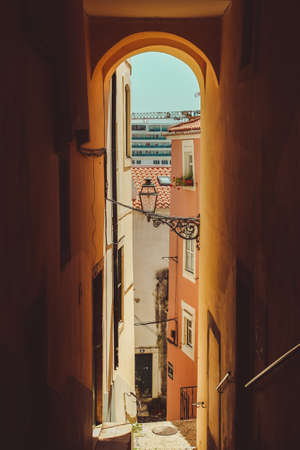 A vertical shot of a neighborhood with colorful buildings in Lisbonの写真素材