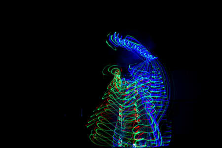 A cool beautifully made background of colorful lights created with a slow shutter speedの写真素材