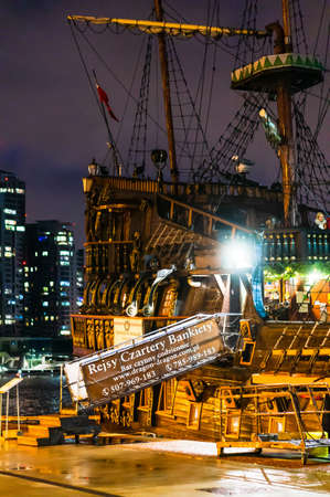 GDYNIA, POLAND - Jan 04, 2020: Wooden ship with restaurant at the port of the city during the night.