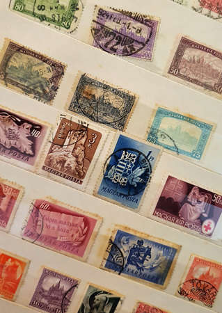 SOVATA, ROMANIA - Jul 02, 2020: many old postage stamps in a philatelic fileのeditorial素材