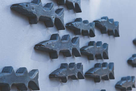 A selective focus shot of fish decoration on the wallの写真素材