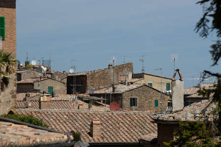 A high angle shot of the roofs of the old village houses under the dull skyの写真素材
